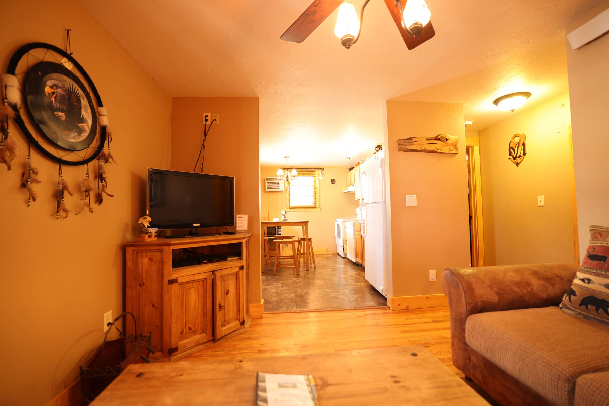 A living room with a couch and television in it