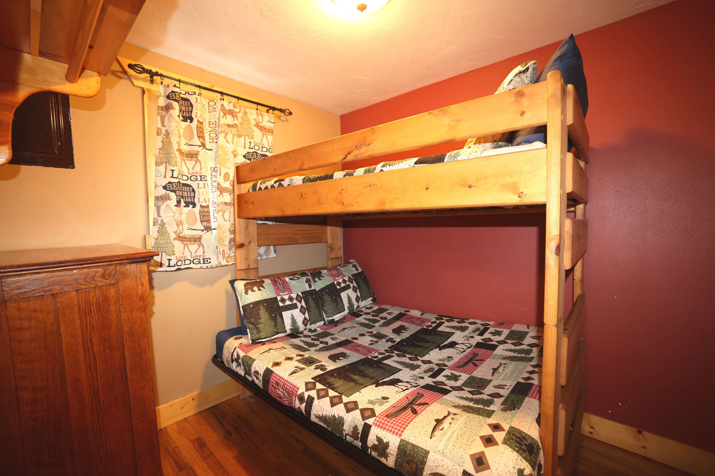 A bedroom with bunk beds and a bed in it