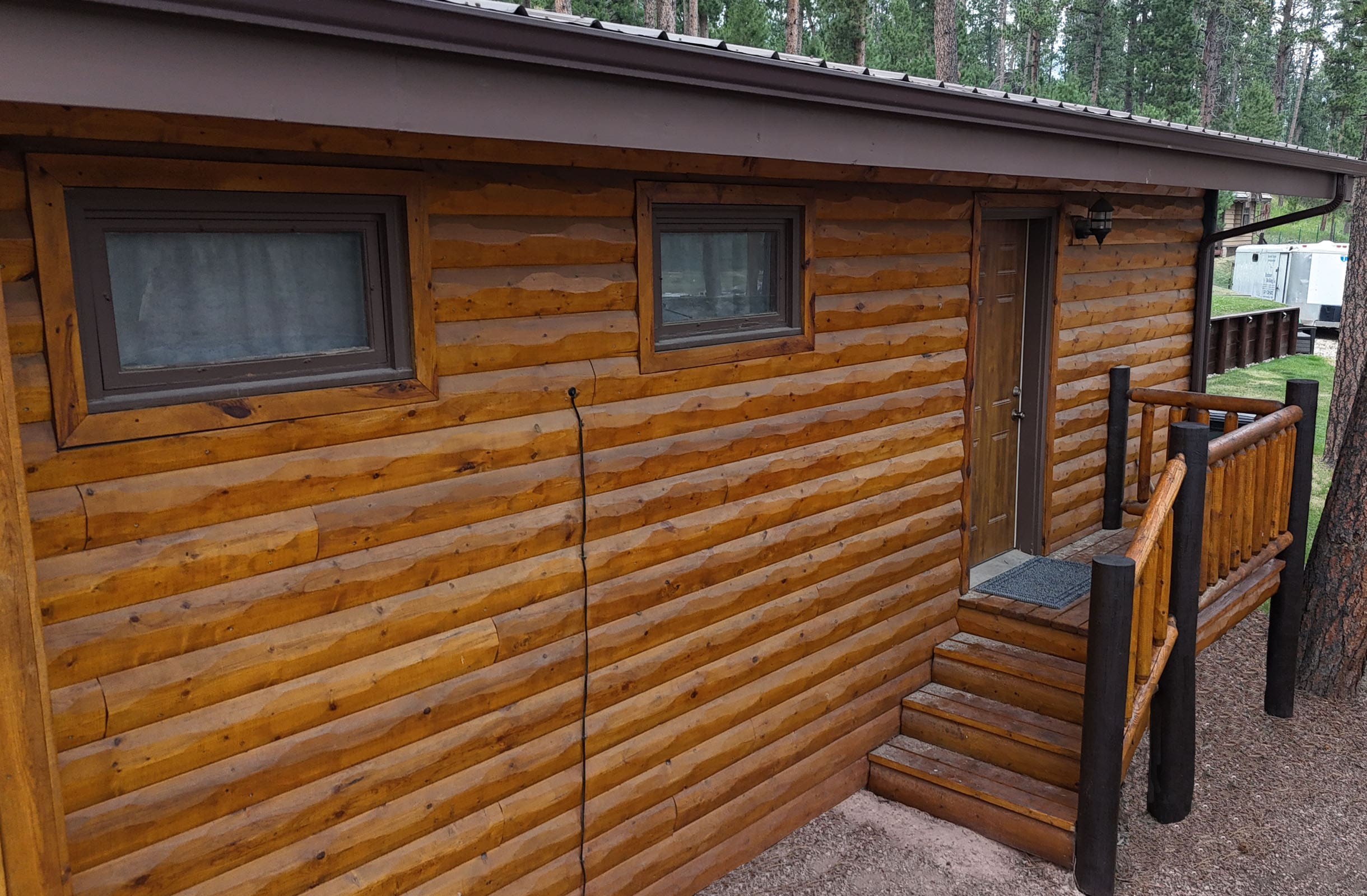 A wooden house with a lot of windows