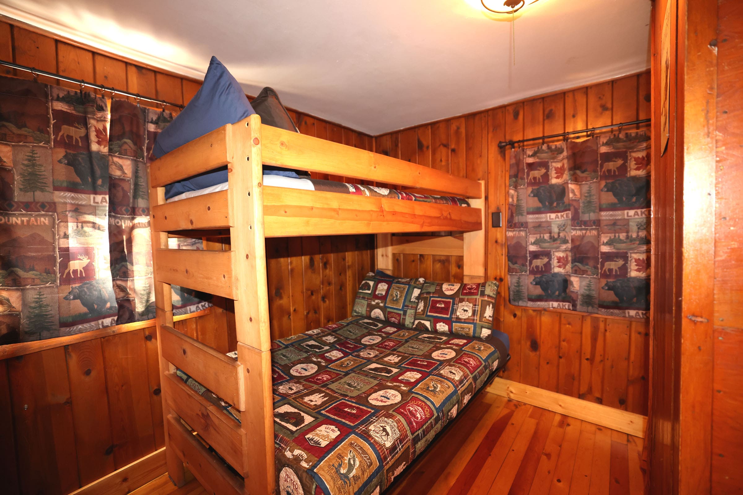 A bunk bed in the middle of a room.